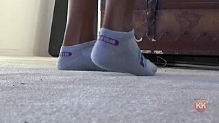 a cougar indulges in her puma socks fetish, teasing with ebony feet
