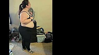 A chubby brunette amateur strips and dances sensually, ripping her clothes in a solo bbw performance