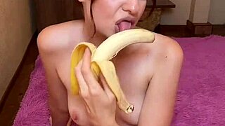 brunette teen sucking banana playfully