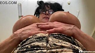 Busty mother-in-law strips and rubs huge tits intensely