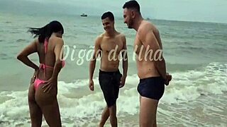 Gostosa is fucking two guys on the beach, her long hair flowing! 🌊