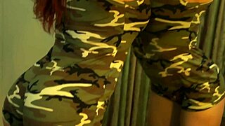 Busty redhead milf flexes her muscular body in front of the mirror