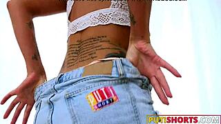 tattooed babe in denim shorts takes a huge cock outdoors