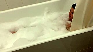 Skinny young blonde in bubble bath webcam, her small tits exposed as she gets fucked hard by gay amateurs!