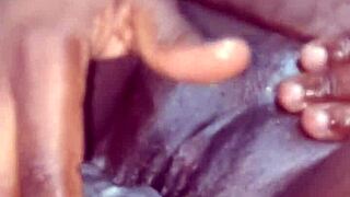 Ebony woman doing a solo session with big tits and ass using dildo