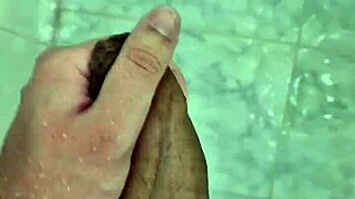 Cute Brazilian twink masturbates solo in homemade shower scene.