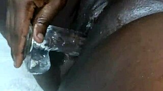 Ebony woman doing a solo session with big tits and ass using dildo