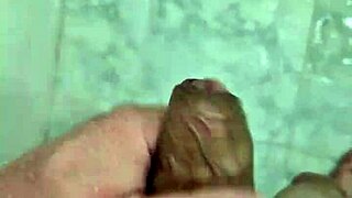 Cute Brazilian twink masturbates solo in homemade shower scene.