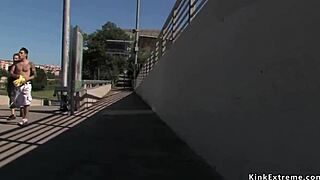 Handcuffed blonde sucking dicks outdoor