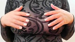 Wearing a sweatshirt that reveals large breasts and nipples