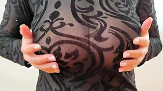 Wearing a sweatshirt that reveals large breasts and nipples