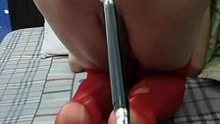 Ladyboy Yiyi engages in intense anal masturbation with a machine