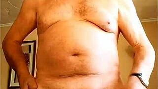 Mature woman gives handjob to hairy cock, masturbating to cumshot on homemade video