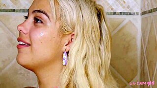 Adorable blonde enjoys a relaxing shower