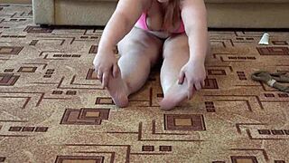 a fat girl licks her legs in pantyhose while masturbating