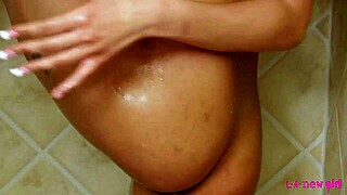 Steamy shower scene with a petite brunette