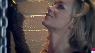 A blonde sucks tied up guy's dick with bdsm mask