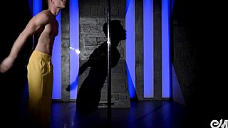 watch this hot young guy strip and dance acrobatically on the pole, tearing clothes off