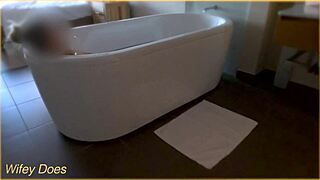 wife gets all wet in the hotel bath with her big tits