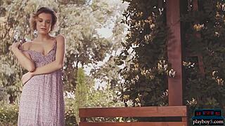 Russian milf model stuns naked in wild outdoor setting.