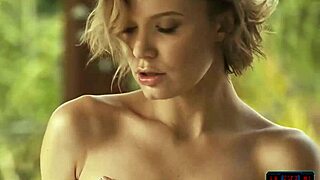 Russian milf model stuns naked in wild outdoor setting.