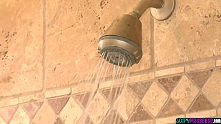 BUSTY ASIAN MASSEUSE STROKES DICK IN SHOWER SESSION.