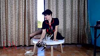 The milf in stockings performs a striptease on the desk at the party