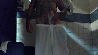 just stroking this big tattooed white dick in the shower for fun.