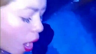 Horny brunette in costume gets spit on and banged in men's bathroom.