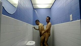 Two guys shower together in the bathroom