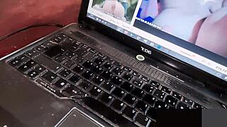 Alone at home, she indulges in porn and self-pleasure with fingering