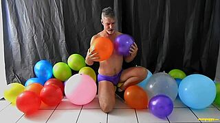 yo, check richard lennox, this horny gay dilf, playing with balloons! 🎈