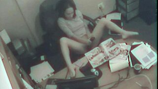 Office blonde secretly fingers pussy during work hours.