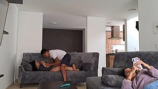 Horny mature woman masturbates on the sofa while stepdaughter distracts, then stepson surprises her