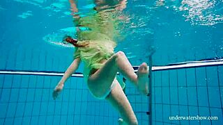 Nina Mohnatka shows off hairy pussy while bathing in tight underwater shots.