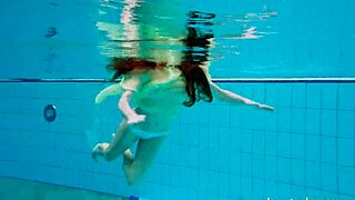 Nina Mohnatka shows off hairy pussy while bathing in tight underwater shots.