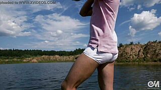 Naked men wash car outdoors