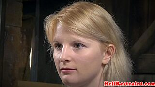 bound sub hangs helplessly as her maledom master takes control