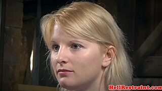 bound sub hangs helplessly as her maledom master takes control