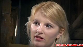 bound sub hangs helplessly as her maledom master takes control