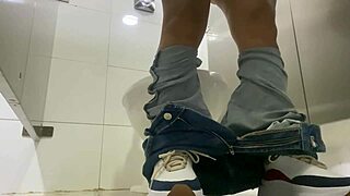 Paying Latina to film herself peeing in public bathroom, she agrees.