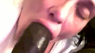 Curious how deep she slurps on that big black cock?