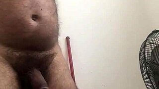 Gay guy strokes his huge penis