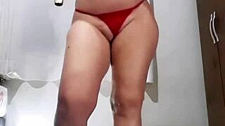 this naughty slut smokes while undressing for fun