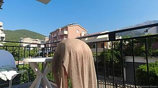 nude in public on a balcony, flashing tits and wet pussy over the road