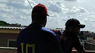 damn, banging this chubby guy on the rooftop while everyone watches!