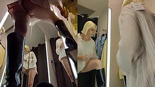 upskirt peek at blonde's pussy in public fitting room
