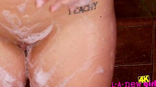 Blonde model refreshes with a relaxing shower after shoot.