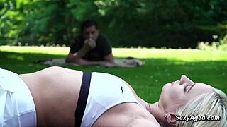 Old man bangs sexy blonde in public park.