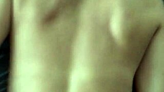 Latin girl poses from behind in a casual setting.